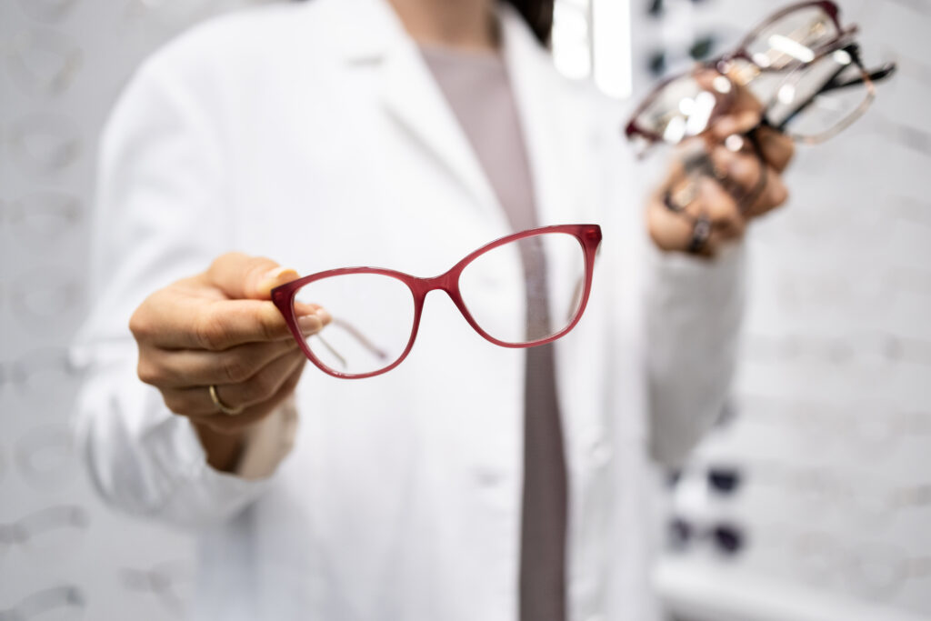 optician holding glasses
