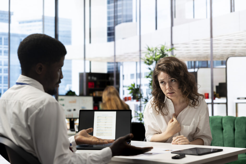Woman feeling upset after not being selected by HR expert vetting applicants, ensuring their skills match role needs. Lady disappointed by headhunter not hiring her after assessing her work experience